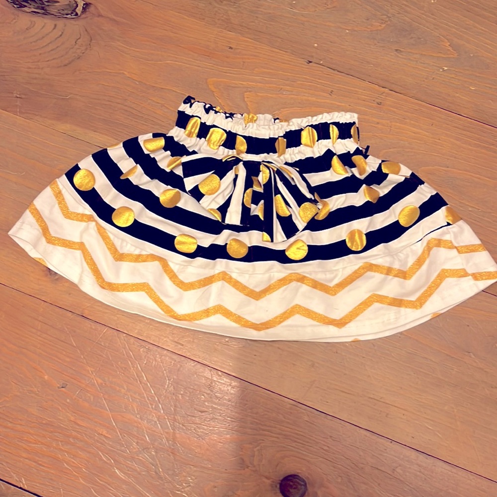 Gold & Black skirt.